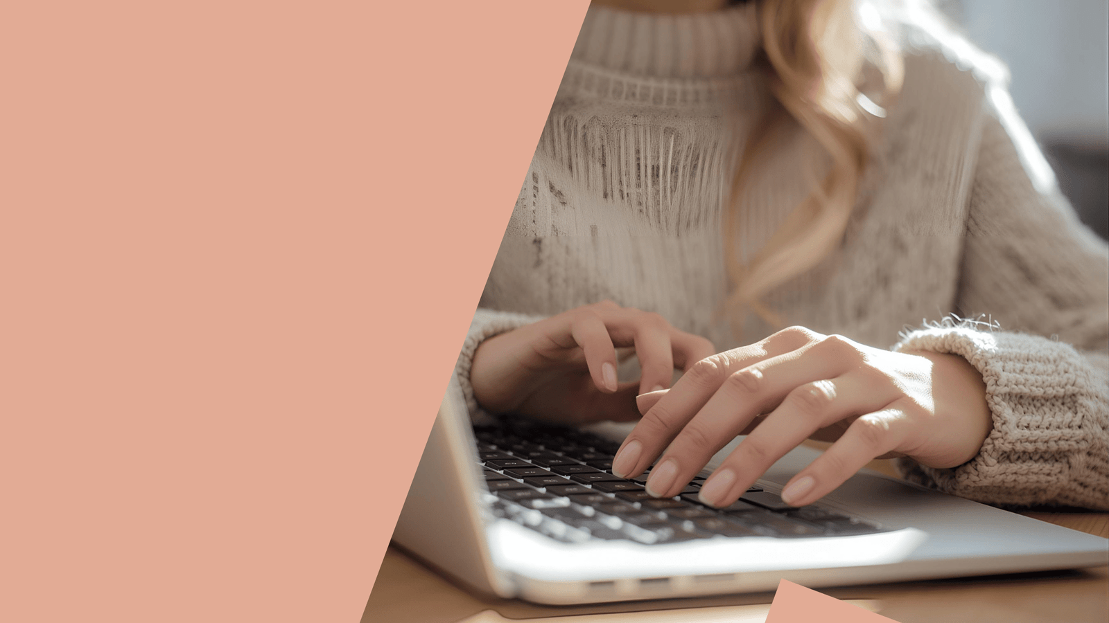 a woman's hands typing on a laptop computer